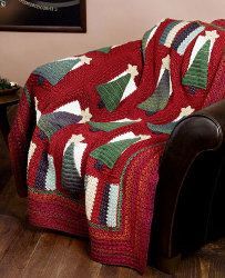 a red blanket sitting on top of a chair