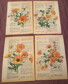 four old book pages with flowers painted on them