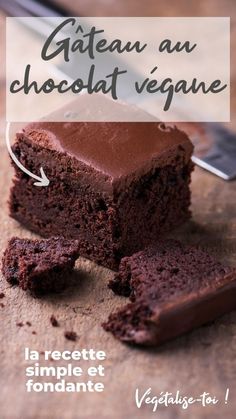 a piece of chocolate cake sitting on top of a cutting board