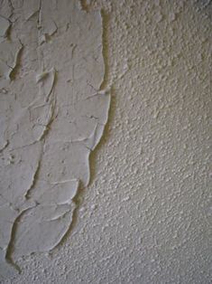 peeling paint on the wall in an empty room