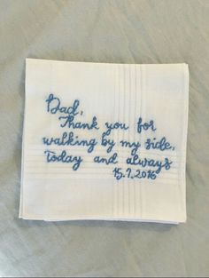 a white handkerchief with blue writing on it that says, dad thank you for walking by my side today and always