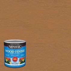 a can of wood finish sitting on top of a wooden floor