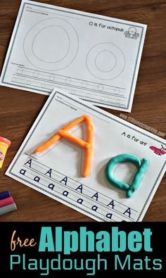 an alphabet playdough mats with scissors and crayons on the table next to it