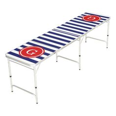 a striped bench with the letter c on it's side and a red circle at the bottom