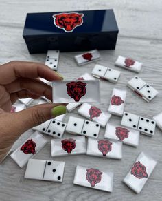 the dices have been placed on top of each other and are being held by someone's hand