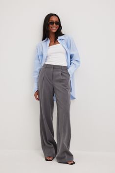 These trousers are low-waist and feature a long wide leg. They have belt loops and a zipper, hook and button closure. These trousers feature side slant pockets and back mock pockets. Inseam length in size 36: 81 cm / 31.88 in. Straight Hem Pants With Button Closure For Work, Button Closure Wide Leg Pants For Office, Office Wide Leg Full Length Pants With Pockets, Tailored Wide Leg Dress Pants With Button Closure, Office Wide Leg Full-length Pants With Pockets, Tailored Wide Leg Pants With Button Closure For Workwear, Wide-leg Pants With Button Closure For Office, Wide-leg Pants With Button Closure For Work, Wide-leg Office Pants With Button Closure