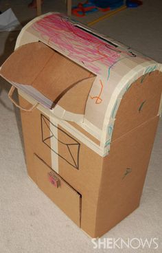 an open cardboard box sitting on the floor