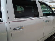 a white pickup truck parked in a garage