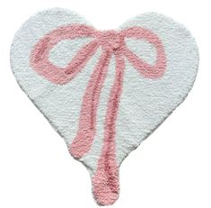 a white and pink heart shaped rug with a bow on the front, isolated against a white background