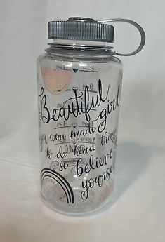 a glass jar with writing on it