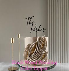 there is a cake that has been decorated with gold and white icing on it