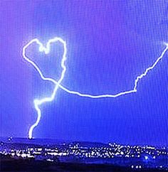 a lightning bolt is seen in the night sky