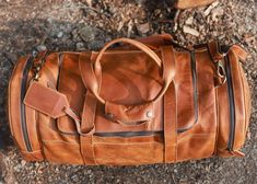 Description Features Shipping If you are not a leather expert and looking for a genuine leather holdall, don’t stress we’ve got you an amazing leather holdall which is just perfect for traveling and several other activities. This bag is made from full-grain leather which smells very pleasing. The leather quality on this bag is very premium and yet the leather is breathable. The tan look on this bag is very alluring and would make you stand out from the crowd. The bag is nicely stitched by our skilled artisans from small villages which work for us with sheer love and compassion. The zippers on this bag are very solid and won’t break. Colour: Tan Brown Leather: Full-Grain Leather Dimensions: 24L x 10.5H x 7.5D Ample interior storage space Leather Luggage Tag 2 large side pockets 2 small side Leather Duffle Bag With Leather Lining For Trips, Leather Patch Tote Shoulder Bag For Travel, Leather Weekender Bag For Trips, Rectangular Leather Patch Shoulder Bag For Travel, Leather Backed Satchel Travel Bag For Weekend Trips, Leather Satchel For Trip, Textured Leather Travel Bag, Leather Duffle Bag With Leather Backing For Weekend Trips, Brown Textured Leather Duffle Bag For Travel