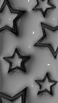 several black and white stars on a gray background