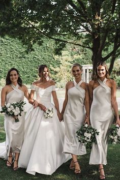 the bridesmaids are all dressed in white dresses