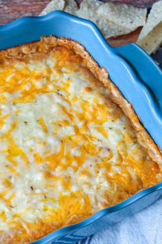 a casserole dish with cheese and tortilla chips