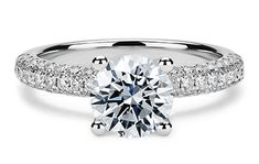 a diamond engagement ring with pave set shoulders