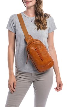 Crafted from vegetable-dyed leather, this minimalist yet functional bag features a sling silhouette for hands-free style. Textile with leather trim Imported Brown Soft Leather Chest Bag For Everyday Use, Brown Leather Chest Bag For Everyday Use, Brown Leather Chest Bag With Adjustable Strap, Versatile Brown Crossbody Chest Bag, Versatile Leather Satchel Chest Bag, Versatile Leather Chest Bag Shaped As Satchel, Brown Chest Bag For Everyday Use, Everyday Soft Leather Crossbody Chest Bag, Soft Leather Crossbody Chest Bag For Everyday Use