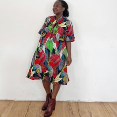 You will glow in our furaha dress. Furaha means happiness in Swahili. Our loose fit colourful dresses made out of non-stretchy African print are perfect for you in case you are looking for a style idea that is versatile, comfortable, and looks fabulous year-round. All materials used to design the dresses are sourced in Kenya.  MEASUREMENT GUIDE:  We recommend asking questions about sizes or you can take your own measurements (at the bust) if unsafe. Since its an A- Line, you only need to ensure Multicolor Vacation Dress With Pockets, Casual Multicolor Dress With Pockets, Multicolor Short Sleeve Dresses With Abstract Print, Casual Dresses With Bold Multicolor Print, Casual Midi Dress With Vibrant Print, Red Short Sleeve Dress With Colorful Pattern, Red Vacation Dresses With Pockets, Multicolor Abstract Print Short Sleeve Dresses, Red Vacation Dress With Pockets