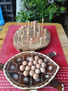 a table topped with a cake and lots of eggs on top of a wooden plate