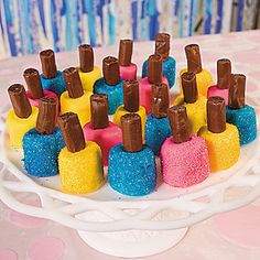 there is a cake that has been made to look like mini bottles with chocolate on top