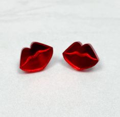 Lips stud earrings are fun for Valentine's Day or any day of the year!   Currently available in red, light pink, pink mirror, and red mirror.  The earrings are acrylic and come with surgical steel posts and backs.  Rubber stoppers will be included as well.  FREE SHIPPING!! Valentines earrings are made to order in-house.  I will ship them out within 3 business days. If you have any questions, please reach out!  Thank you for taking a look! Valentine's Day Gift Drop Clip-on Earrings, Trendy Earrings For Valentine's Day Gift, Trendy Valentine's Day Earrings For Gift, Trendy Valentine's Day Gift Earrings, Nickel Free Novelty Earrings For Party, Novelty Hypoallergenic Earrings For Party, Novelty Hypoallergenic Party Earrings, Hypoallergenic Novelty Earrings For Party, Hypoallergenic Novelty Party Earrings