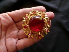 "This vintage unsigned red and pink rhinestone brooch is beautiful and in very good condition. I am unsure of the year this was made, but its more than 40 years old and looks like a \"made in Austria\" piece.  Measures about 2 inches and not too very heavy. No damage, oxidation or problems to note, just slight wear, mostly on the back. I have not attempted to clean this in any way. More vintage costume jewelry here:  https://www.etsy.com/shop/badkittyvintagefinds?ref=seller-platform-mcnav&sectio Antique Red Brooch As Gift, Antique Red Brooches For Gift, Antique Red Brooches As Gift, Antique Red Brooches As A Gift, Antique Red Wedding Brooch, Vintage Red Wedding Brooches, Red Formal Costume Jewelry Brooches, Vintage Red Brooches For Party, Vintage Table Setting