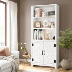 a living room with a white bookcase next to a window