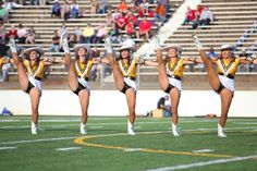 a group of cheerleaders perform on the field