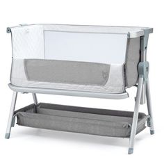 a baby crib with two trays attached to the side and one in front