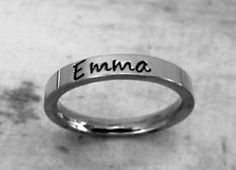 This GOREOUS 3 mm ring is comfortably stackable up to three rings. The surface is flat, so the lettering really stands out. I can fit up to 4 names/dates/quotes/scripture/coordinates or roman numerals on each ring! Up to approx. 25 characters depending on size of ring. The finish is super shiny and is very durable. This ring sold in 14 kt. gold plate  Stainless steel will never rust, tarnish, change color or turn your skin green and is hypoallergenic. I only stamp on the outside of the rings.... Minimalist Custom Name Adjustable Ring, Trendy Personalized Adjustable Rings, Personalized Adjustable Stackable Rings, Custom Name Adjustable Stackable Rings For Personalized Gift, Simple Personalized Adjustable Rings, Simple Adjustable Personalized Rings, Simple Adjustable Personalized Ring, Silver Rings With Name Engraving, Custom Name Adjustable Initial Ring For Promise