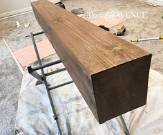 a wooden table being constructed in the middle of a room