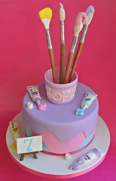 there is a cake that has many brushes in it