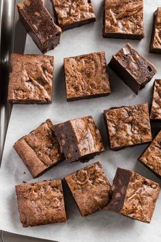 chocolate brownies on a baking sheet ready to be cut into squares and put in the oven