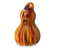 an orange and yellow glass vase on a white background