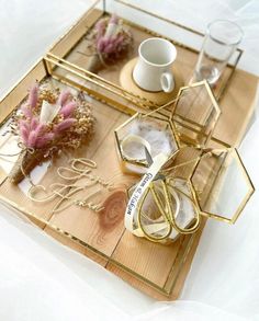 a tray with some flowers and other items on it