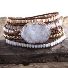 Why we <3 it! +Large White stone crystal +5 Strands +Hand stitched. Druzy Bracelet, Multi Strand Bracelet, Beaded Wrap Bracelets, Druzy Quartz, Boho Leather, Stackable Bracelets, Layered Bracelets, Leather Wrap Bracelet, Nature Bracelets