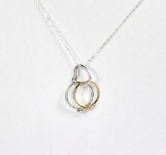 "Sterling silver heart ring holding necklace, featuring a triggerless heart hinged clasp pendant, wear it alone as a classic heart necklace, or to holder your engagement and wedding ring band and other precious rings. This listing is for the ring holder necklace ONLY, ring is not included. The picture with ring is for display purposes only. The solid 925 sterling silver triggerless clasp pendant is about 17mm. Sterling silver chain length of your choice, from 16\" to 20\". Yes, it's a beautiful Holding Necklace, Engagement Ring Holder, Ring Holder Pendant, Engagement Ring Holders, Ring Holder Necklace, Precious Rings, Silver Heart Ring, Necklace Bridal, Etsy Bridesmaid Gifts