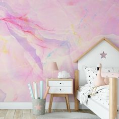 a child's bedroom with pink and purple wallpaper