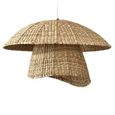 a large woven lamp hanging from a ceiling