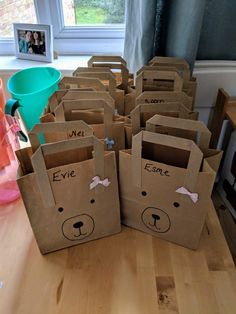 brown paper bags with bears on them sitting on a table