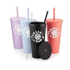 three different colored cups with straws in them