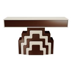 an art deco console table in brown and white