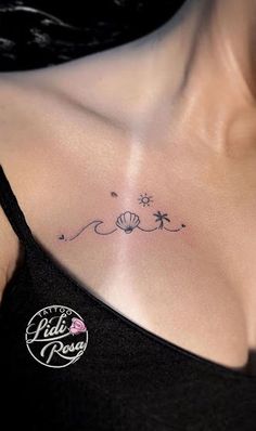 a woman's chest with a small tattoo design on her left side ribcage