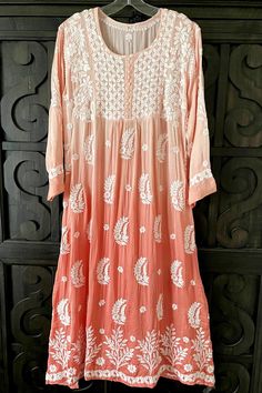 This Peach Pink Ombre A-Line Kurta Dress is designed from luxurious modal satin silk and decorated with traditional floral motifs and the exquisite embroidery of Lucknowi Chikankari. A timeless classic, it seamlessly transitions from a sophisticated ensemble to a more relaxed look. Hand embroidered Modal satin Length 45" inches Long sleeves 19" inches Round neck A line Lucknowi Chikankari embroidery handwork Margin: no Dry clean Phulkari Pants, Lucknowi Kurta, Chikankari Embroidery, Bridal Dupatta, Phulkari Dupatta, Lucknowi Chikankari, Velvet Shawl, Plus Size Suits, Kurta Dress