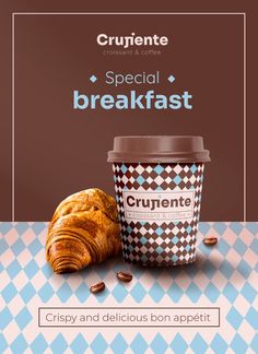 a cup of coffee next to a croissant on a checkered tablecloth