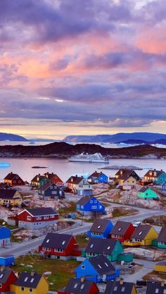 an aerial view of a town with colorful houses