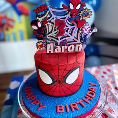 a spiderman birthday cake on a table