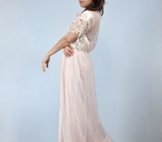 Vintage 1970s-80s peignoir set. Nylon fabric with lace panelling in the prettiest pale pink. ✈ Measurements ✈ * Taken from SEAM to SEAM with garment lying flat * . . . ROBE . . . Bust * 22" Sleeve * 3" Waist * 10 - 19" Hips * 25" Length * 62" . . . NIGHTGOWN . . . Bust * Free Size Waist * 11 - 18" Hips * 25" Length (from empire waist to hem) * 43.5"  ✈ Specifics ✈ Label: UndercoverWear, made in USA Tagged Size: XL Approx. Fit: Medium to Large Color: Pale pink, off-white Material: 100% Nylon Cond Pink Sleepwear For Spring Evenings, Pink Evening Sleepwear For Spring, Pink Spring Evening Sleepwear, Spring Evening Pink Sleepwear, Vintage Pink Sleepwear For Wedding, Vintage Pink Wedding Sleepwear, Pink Feminine Sleepwear For Evening, Feminine Pink Sleepwear For Evening, Feminine Spring Wedding Nightgown