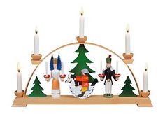 a christmas display with candles and figurines